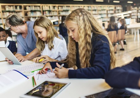 Photo image of teenagers in a classroom setting (Shutterstock image)