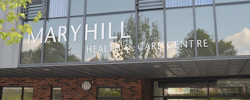 Front entrance of the new Maryhill Health & Care Centre, showing the name on the windows.