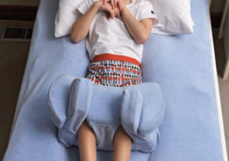 Photo image of a child in a supported lying position (Pamis image)